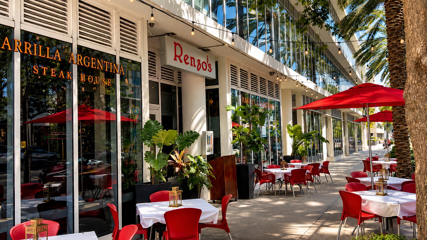 Renzo's St. Pete storefront and sidewalk patio with red umbrellas on 2nd Street South, downtown St. Petersburg