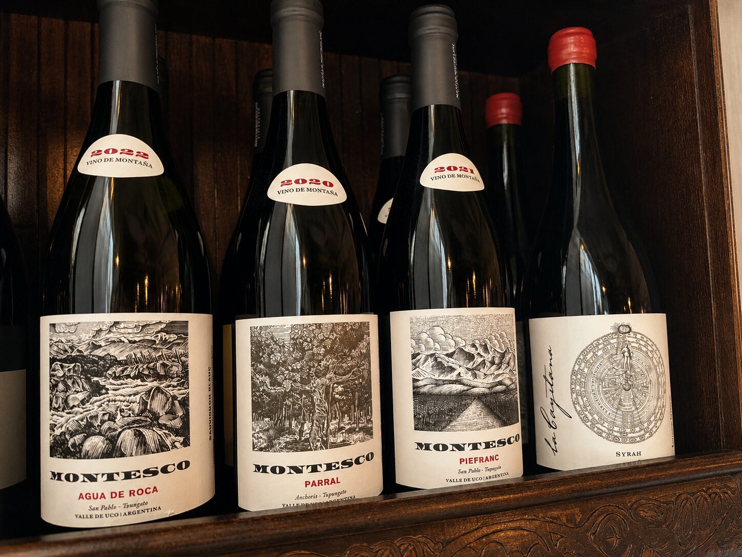 Argentine wine bottles on the carved shelf at Renzo's Wine & Bar, St. Petersburg