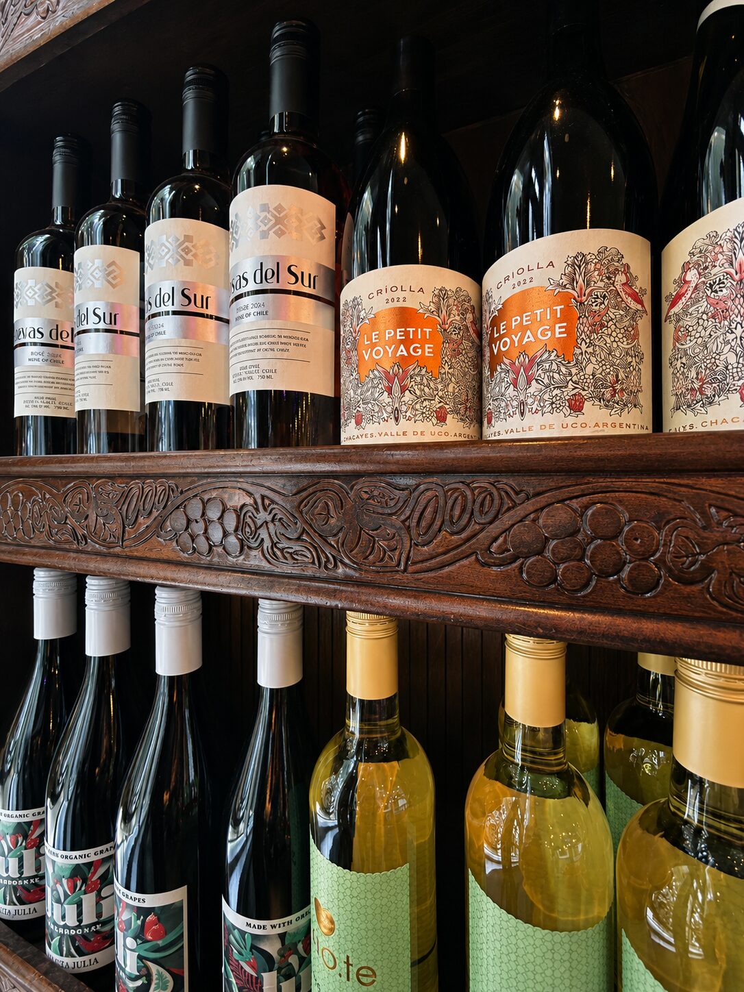 Wine labels along the carved shelf at Renzo's Wine & Bar, St. Petersburg