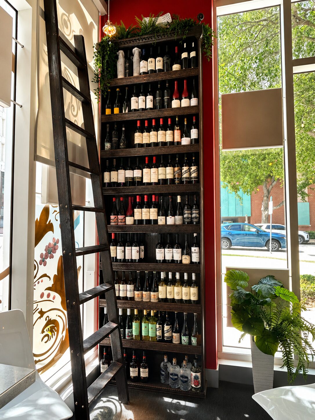 Wine shelves beside the storefront window at Renzo's Wine & Bar, St. Petersburg
